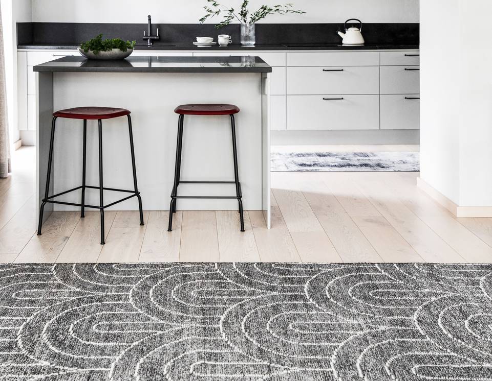 Black / grey  bamboo silk handloom -  Carpet in a living room.