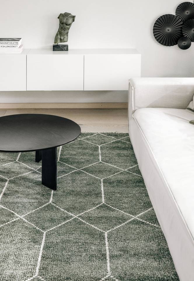Black / grey  bamboo silk handloom -  Carpet in a living room.