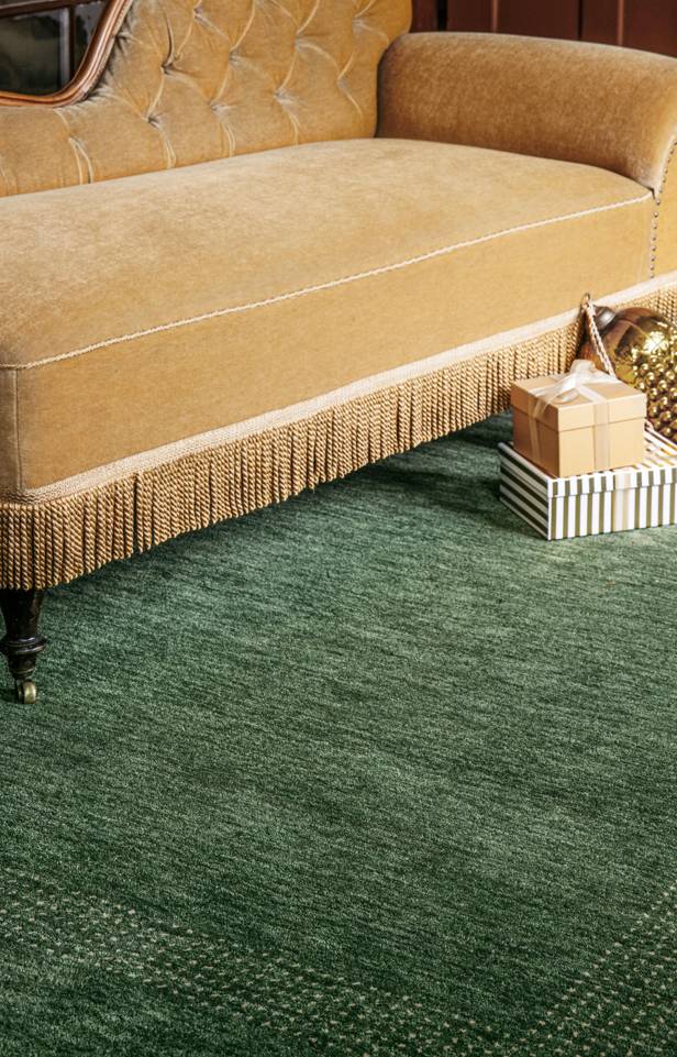Green  handloom -  Carpet in a living room.