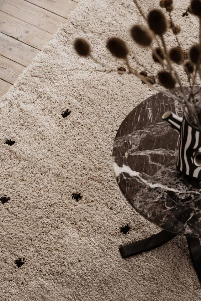 White  kids carpet -   in a living room.
