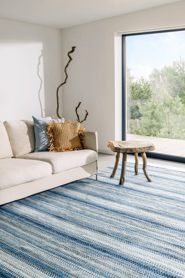 Blue  cotton dhurrie -  Carpet in a living room.