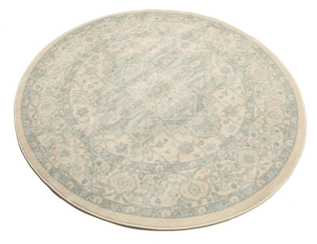 Rond tapijt in crème, beige en lichtblauwe tinten