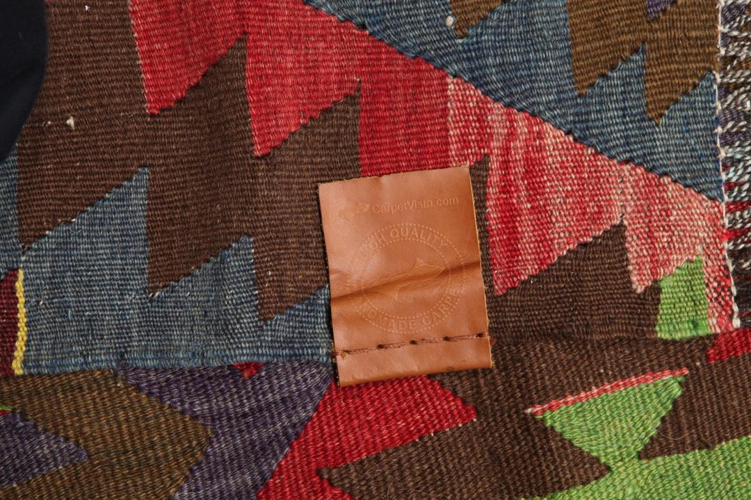 Vintage handgeweven Turks kelimkleed met een geometrisch patroon in multicolor tinten.