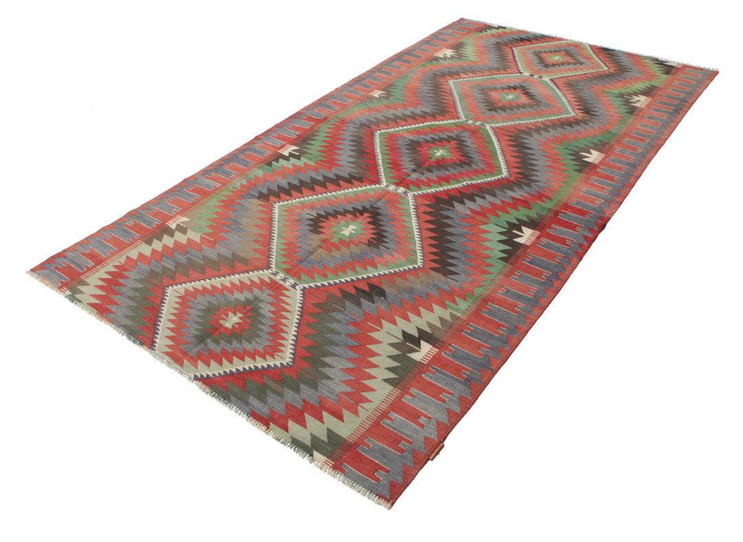 Tapis Kilim turc tissé à la main avec des motifs géométriques en laine multicolore