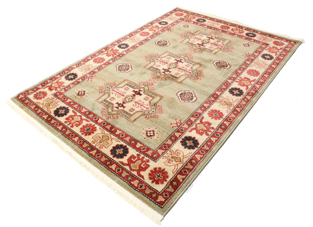 Lichtgroen en crèmekleurig beige vloerkleed met geometrisch patroon