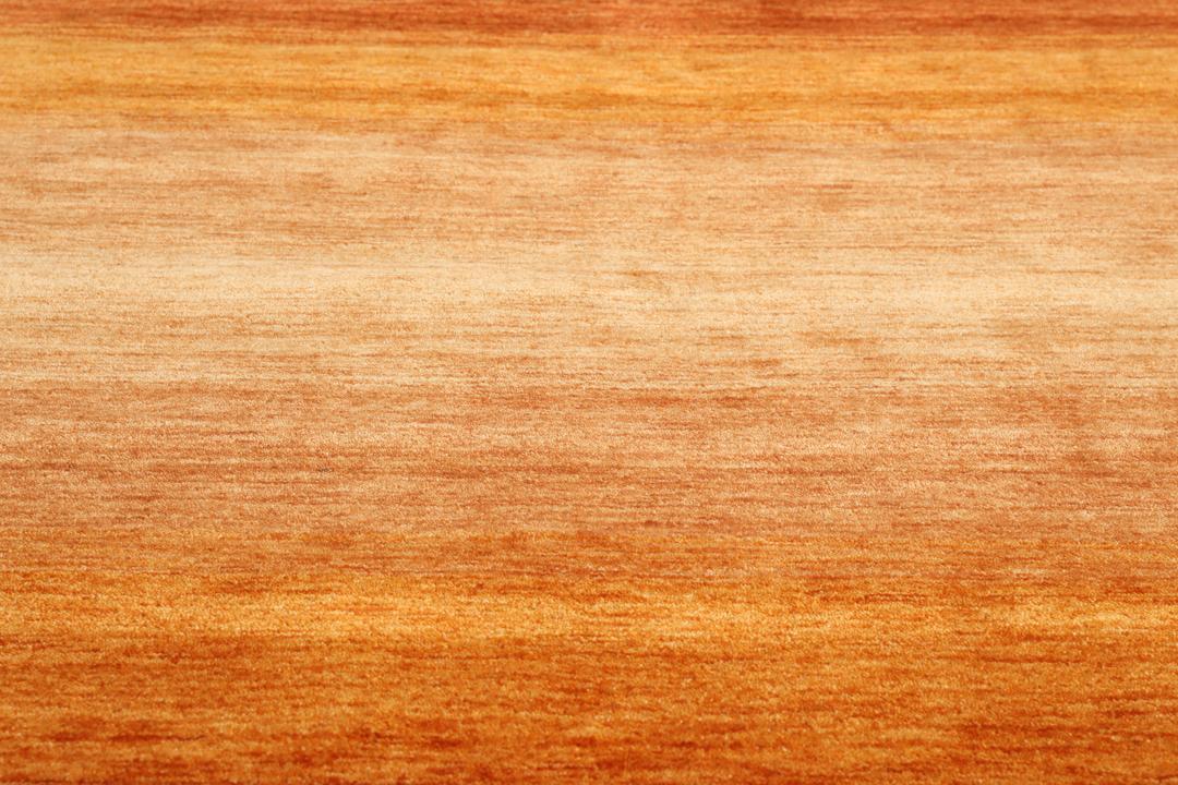Handgeweven tapijt in roest-rood en rood met een ombre gradiënteffect