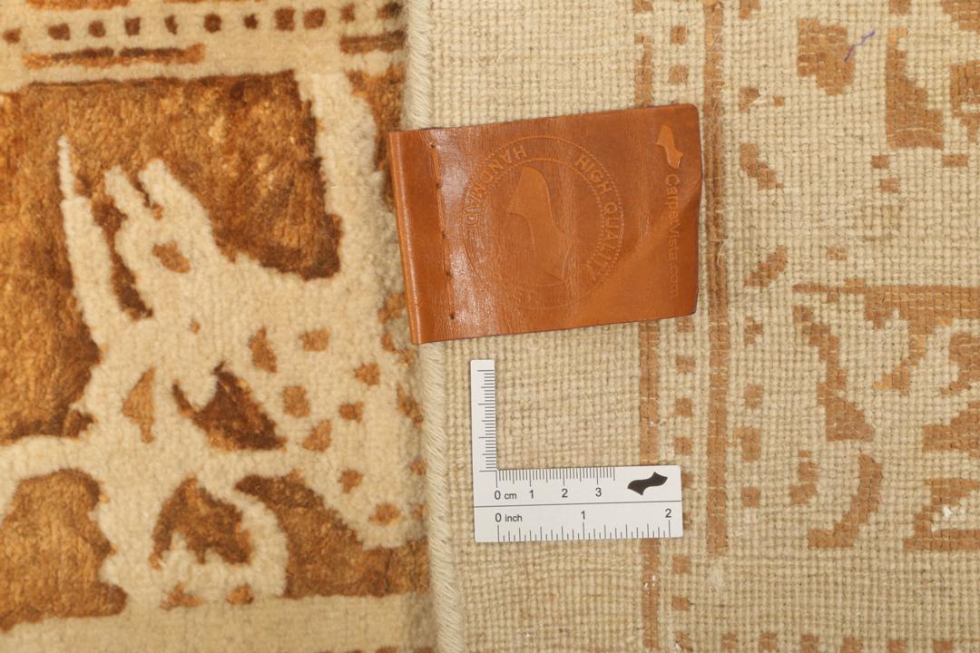 Håndknyttet indisk tæppe med beige og varme brune dyre- og blomstermotiver