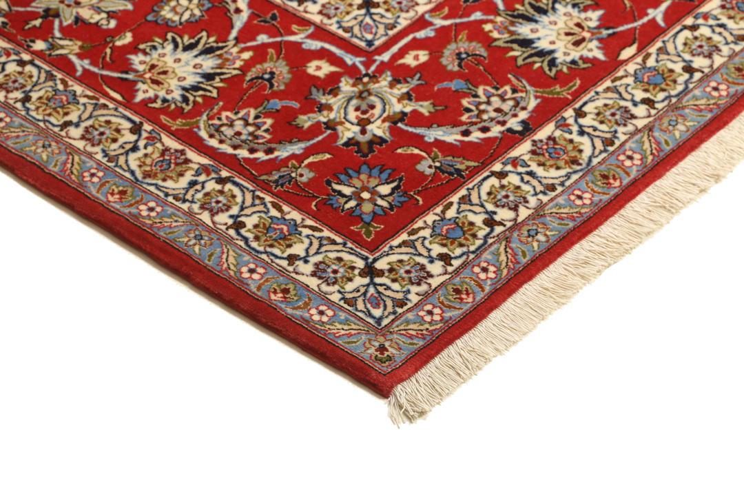 Handgeknoopt Isfahan vloerkleed uit het Midden-Oosten in donkerblauw en rood