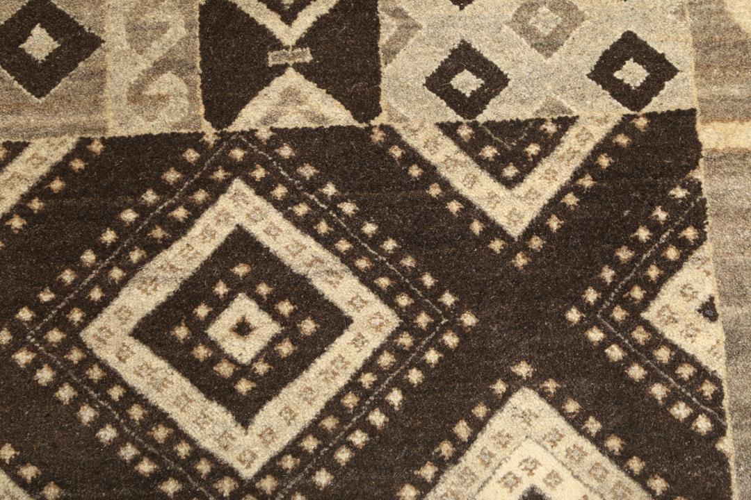 Modern patchwork rug with brown and beige geometric patterns from India