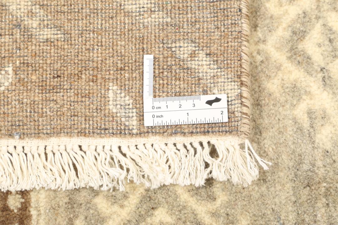 Modern patchwork rug with brown and beige geometric patterns from India