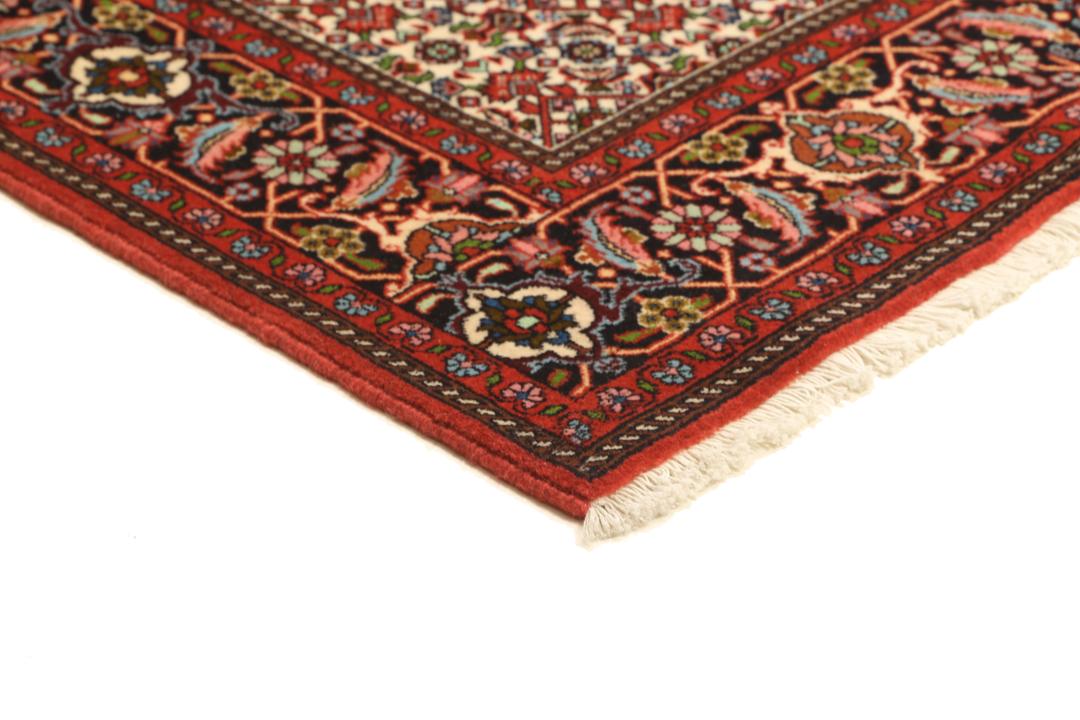 A hand-knotted Bidjar rug from the Middle East in vibrant red and cream tones