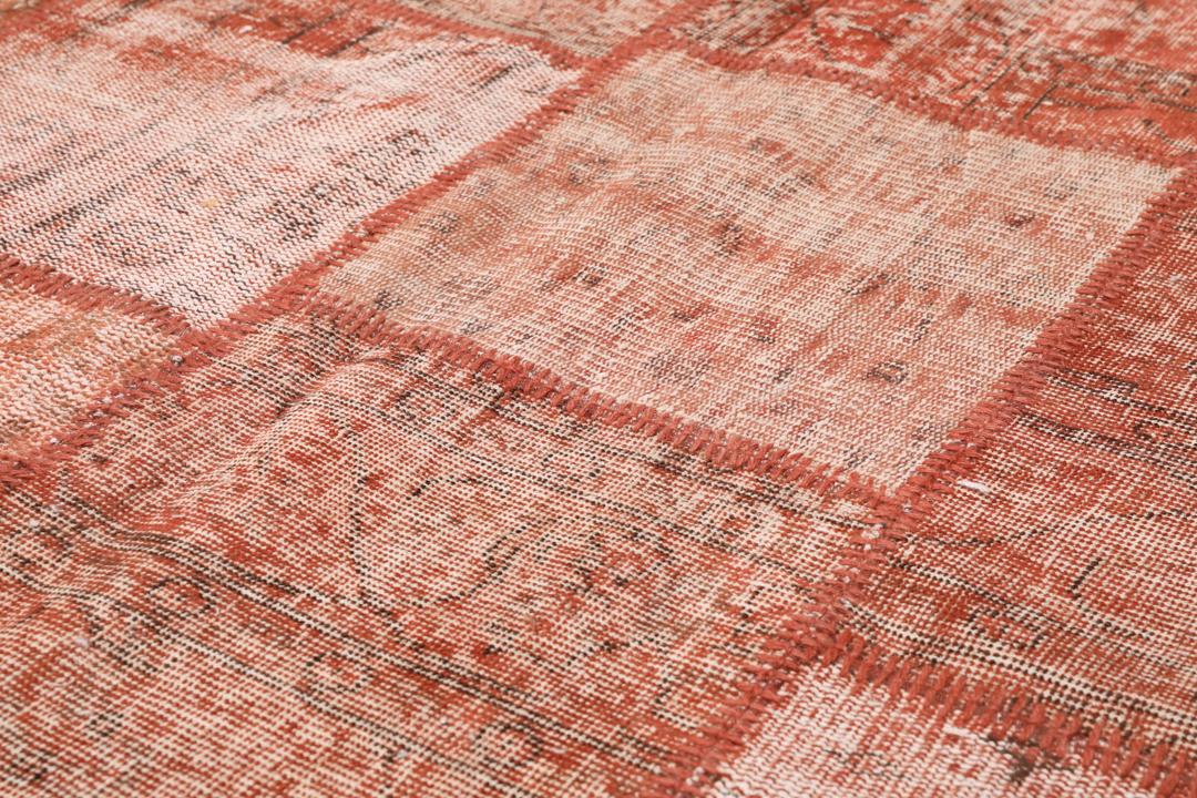 Handgeknoopt Turks patchwork tapijt in warme rode tinten