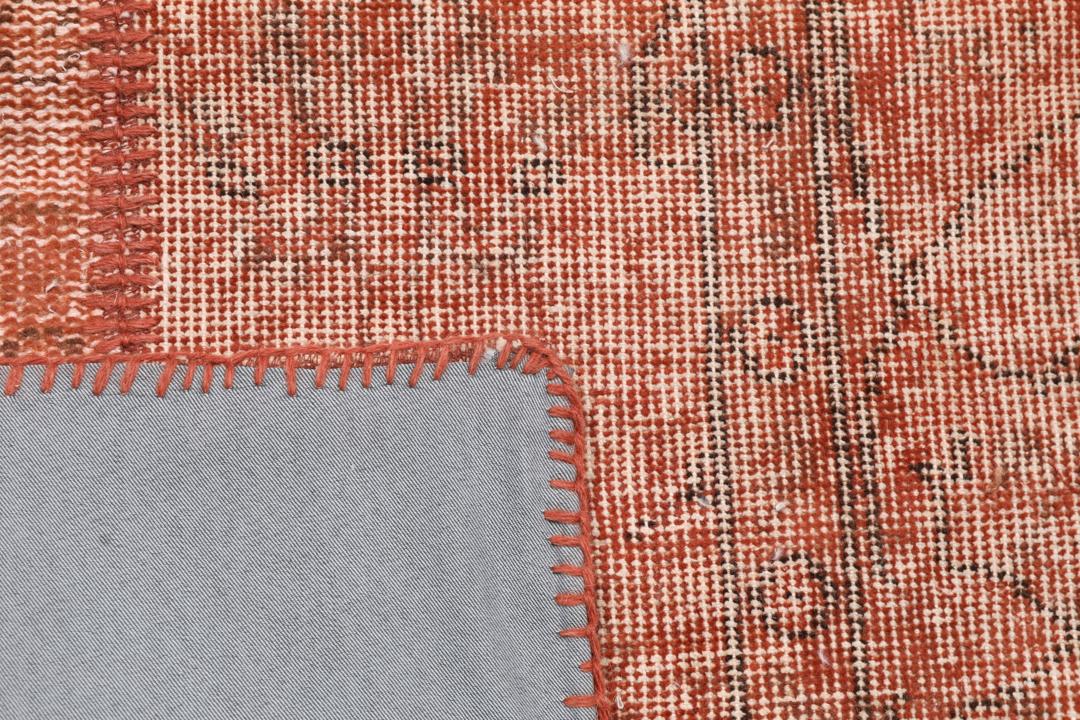 Handgeknoopt Turks patchwork tapijt in warme rode tinten
