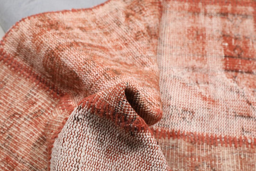 Handgeknoopt Turks patchwork tapijt in warme rode tinten