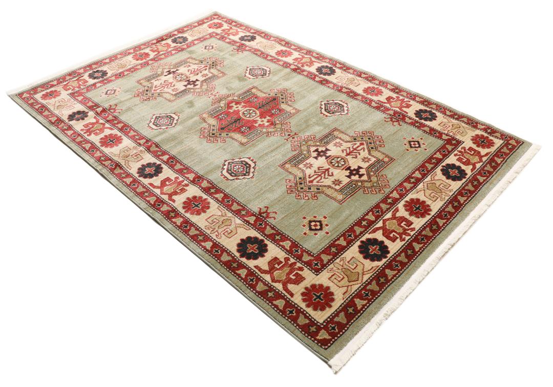 Lichtgroen en crèmekleurig beige vloerkleed met geometrisch patroon