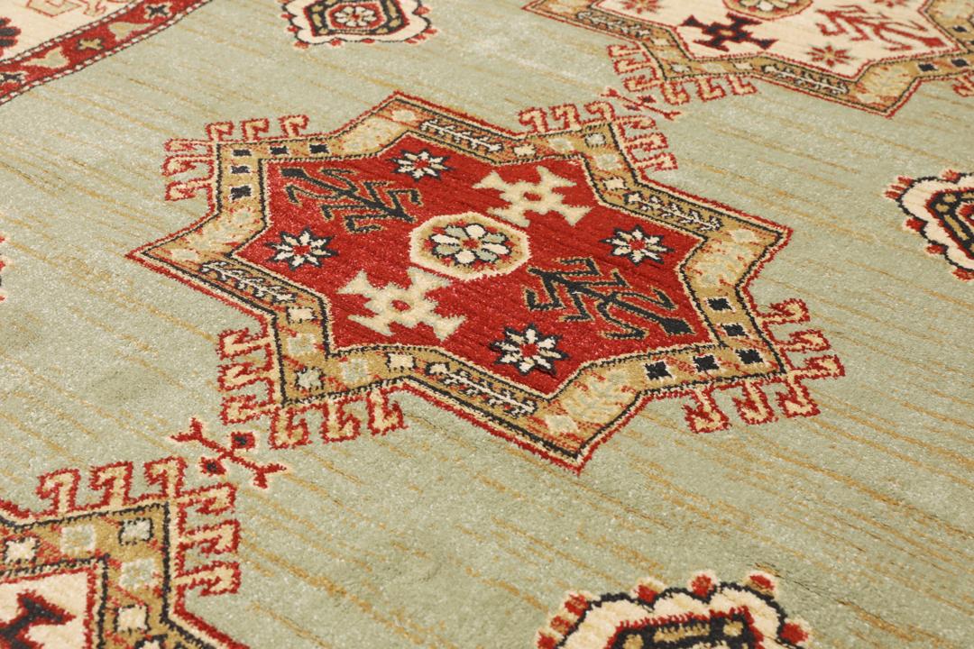 Lichtgroen en crèmekleurig beige vloerkleed met geometrisch patroon