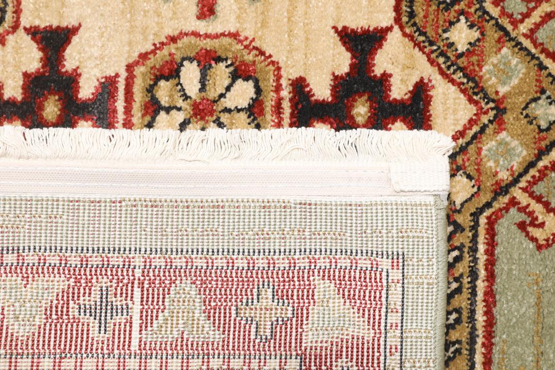 Lichtgroen en crèmekleurig beige vloerkleed met geometrisch patroon