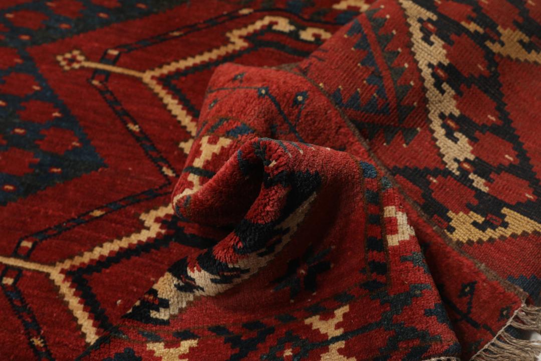 Håndknyttet afghansk Khal Mohammadi-tæppe i dyb rød med geometriske mønstre