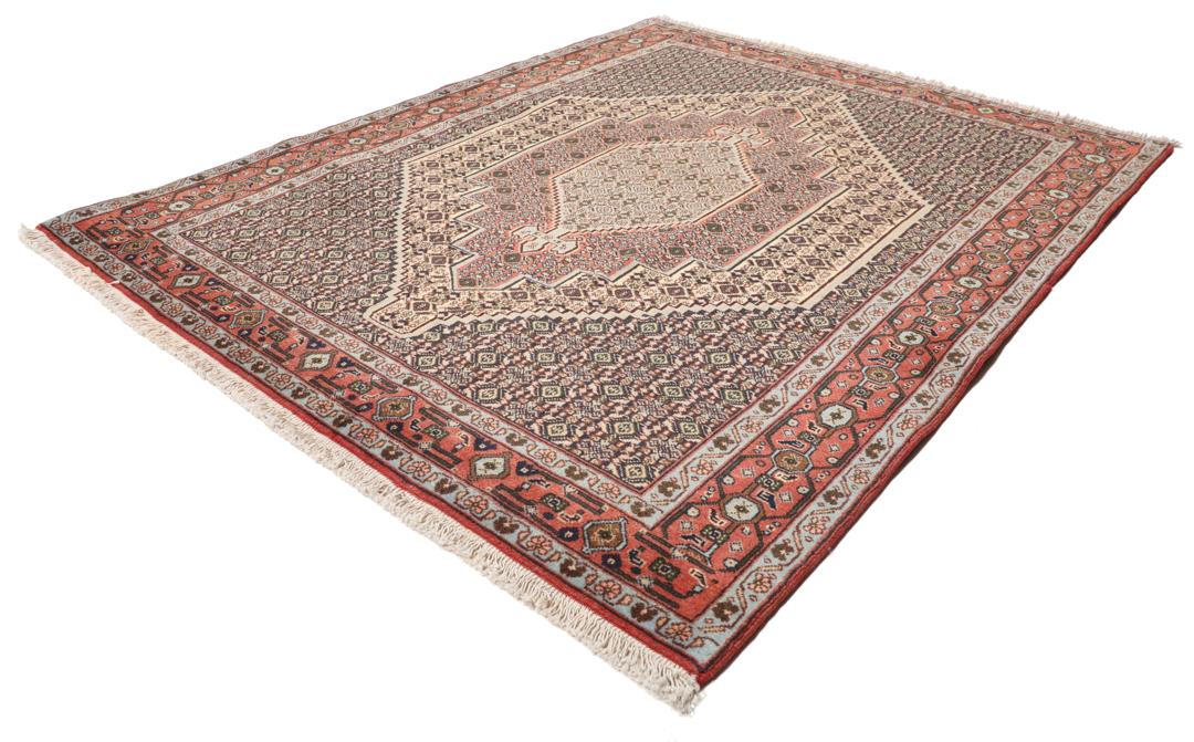 Handgeknoopt Senneh-tapijt uit het Midden-Oosten met een rood en blauw medaillonontwerp