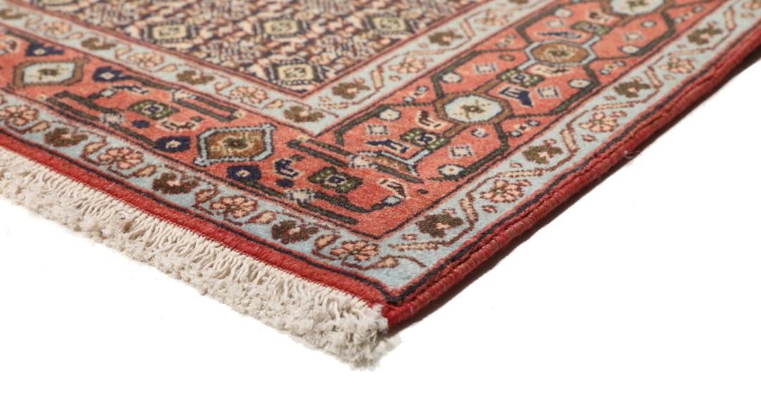 Handgeknoopt Senneh-tapijt uit het Midden-Oosten met een rood en blauw medaillonontwerp