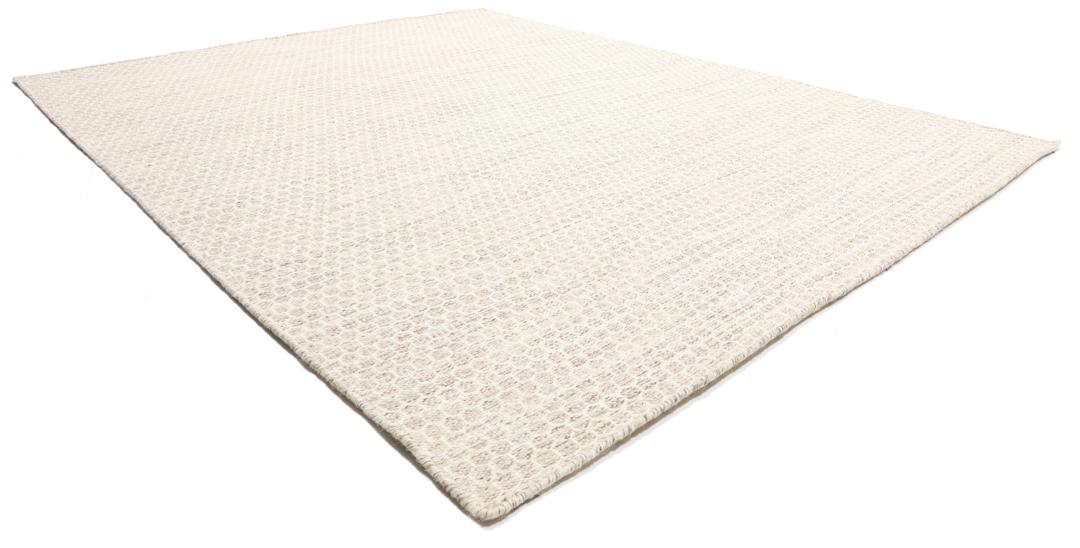 Beige handgeweven wollen tapijt met een subtiel honingraatpatroon