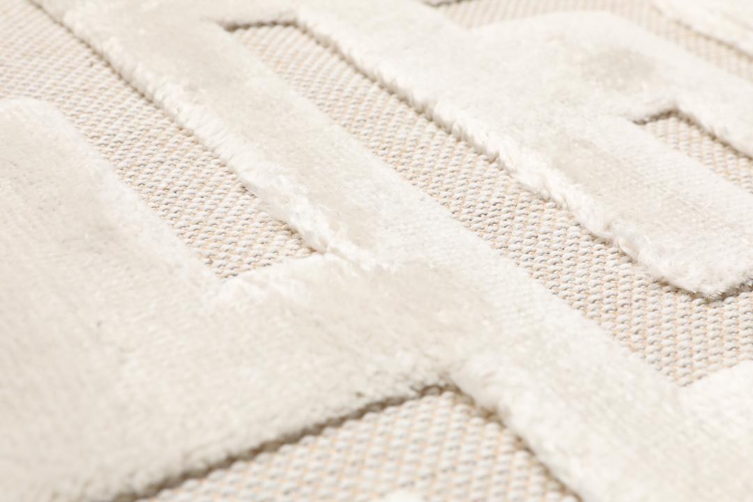Getextureerd crèmewit vloerkleed met hoog en laag poolpatroon