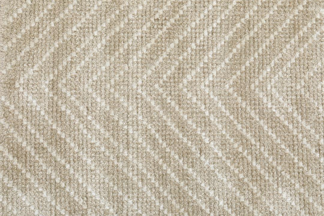 Beige tapijt met een visgraatpatroon