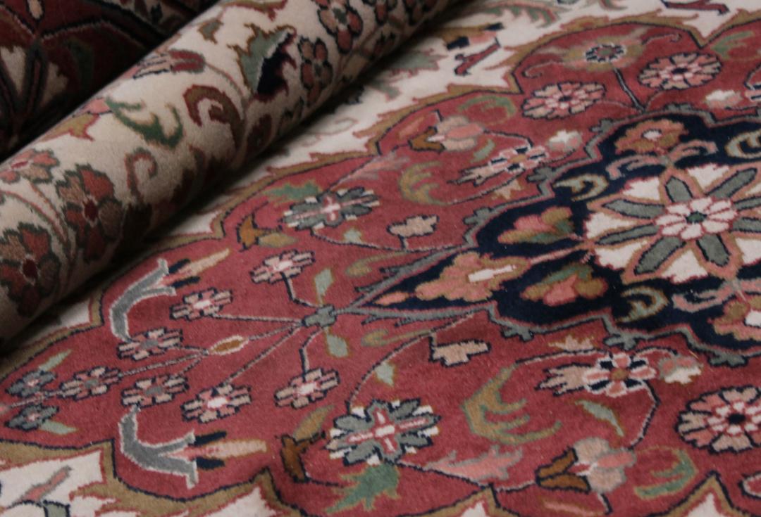 Hand-knotted Tabriz rug from India in red and beige tones
