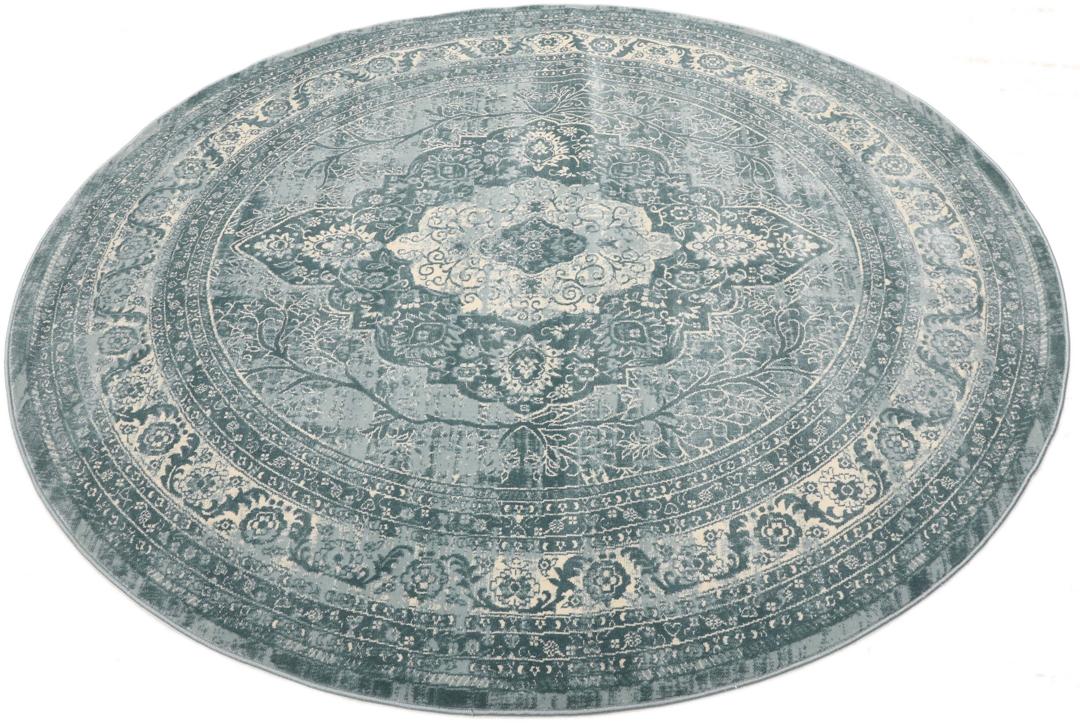 Tapis rond bleu clair avec motif détaillé
