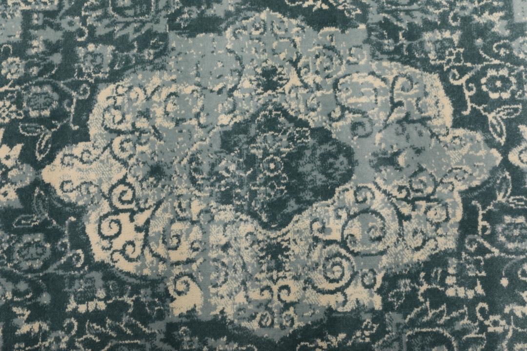 Tapis rond bleu clair avec motif détaillé