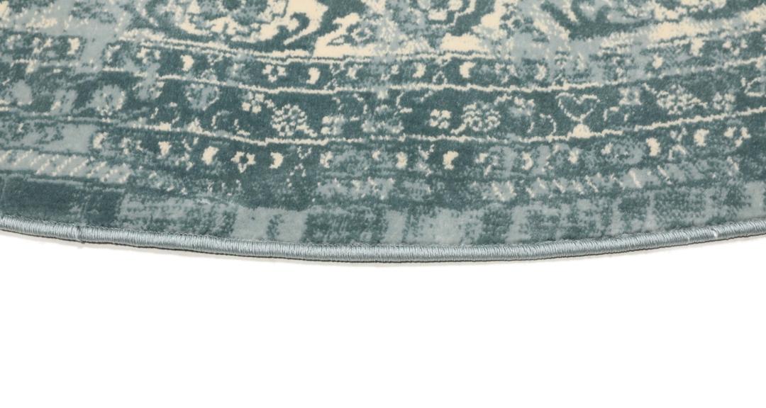 Tapis rond bleu clair avec motif détaillé