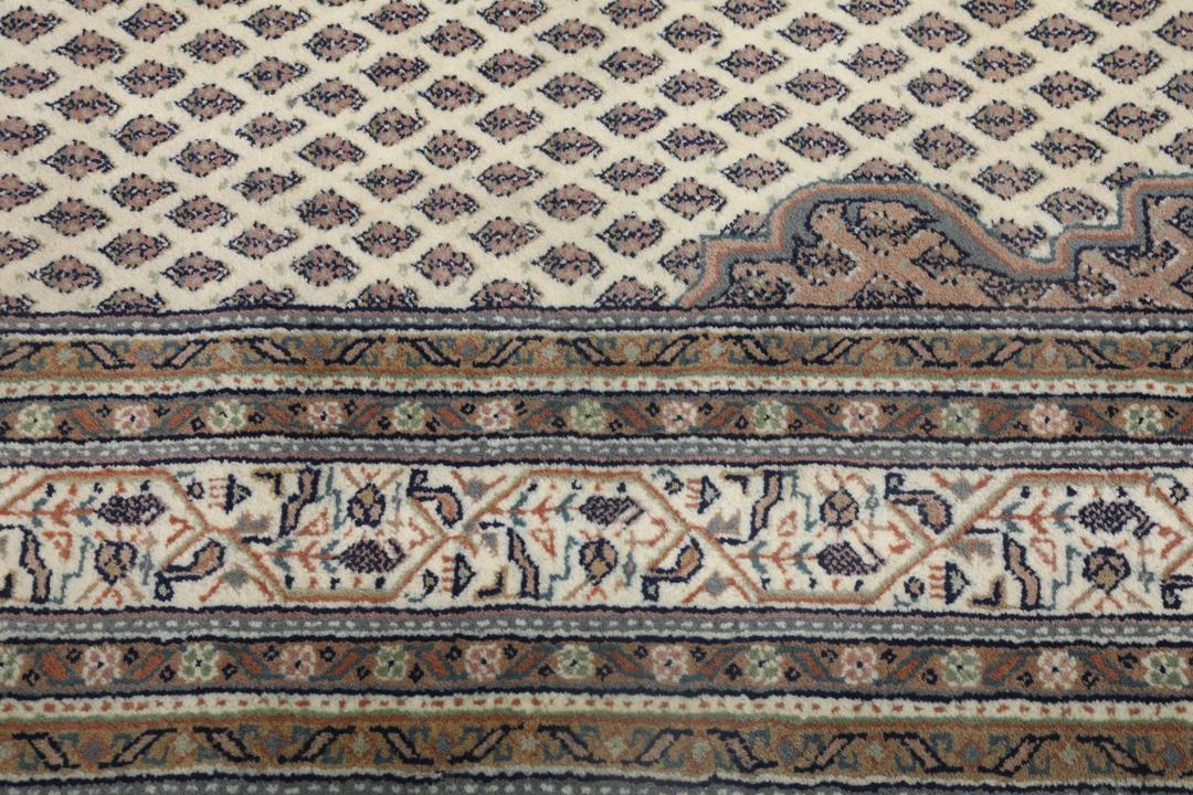 Håndknyttet Mir Indo-tæppe med et beige og brunt mønstret design fra Indien