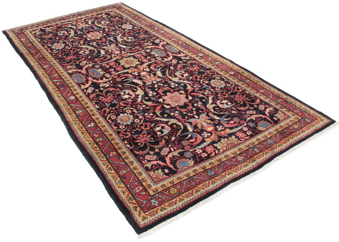 Handgeknoopt Jozan-tapijt uit het Midden-Oosten met een bloemmotief in zwart, rood en blauw.