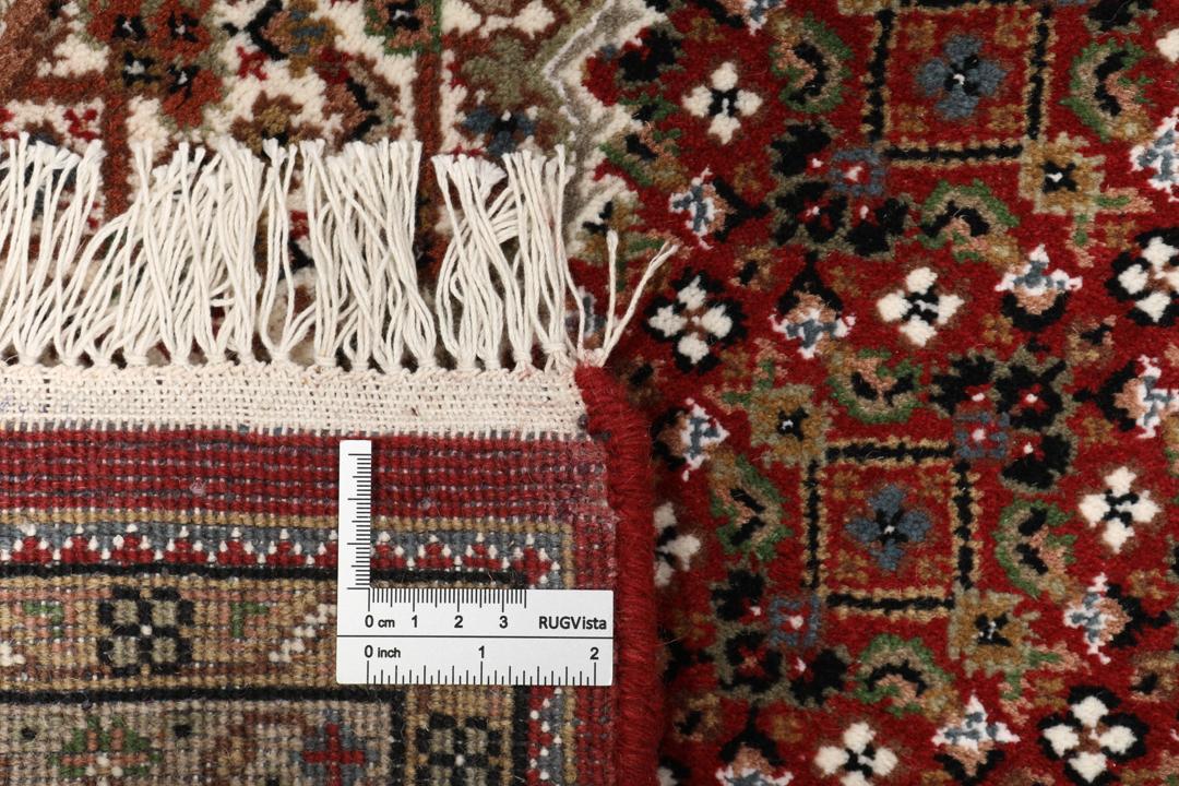 Tapis Tabriz noué à la main originaire d'Inde dans des tons rouges et beiges