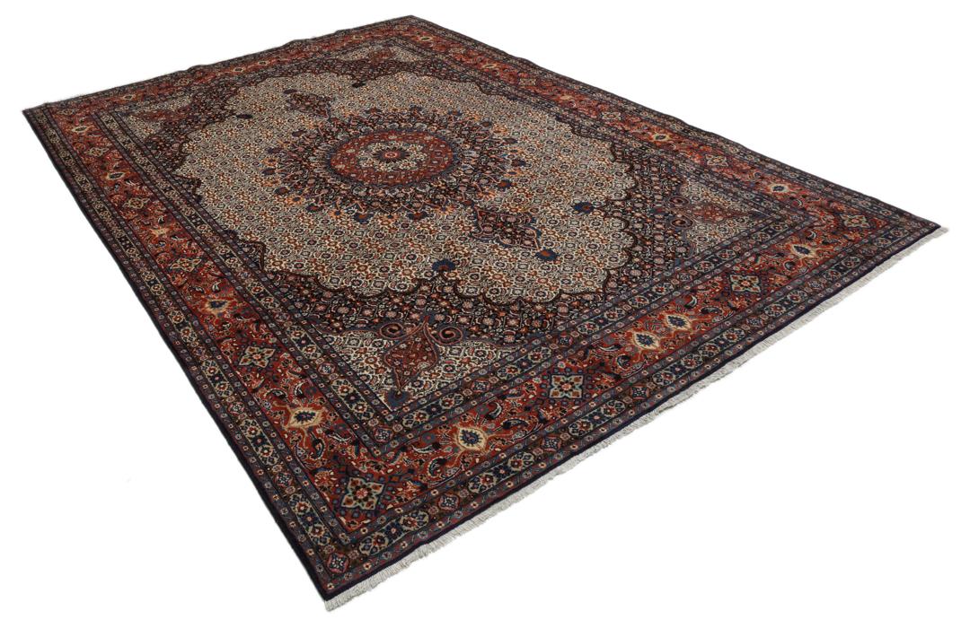 A large rectangular Moud rug from the Middle East featuring a dark-red and beige floral medallion design.
