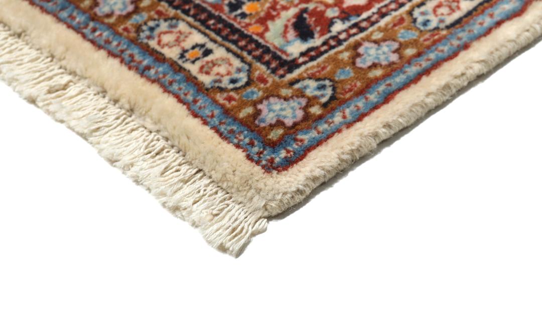 Hand-knotted Moud rug with a central medallion and ornate floral patterns in dark-red and blue