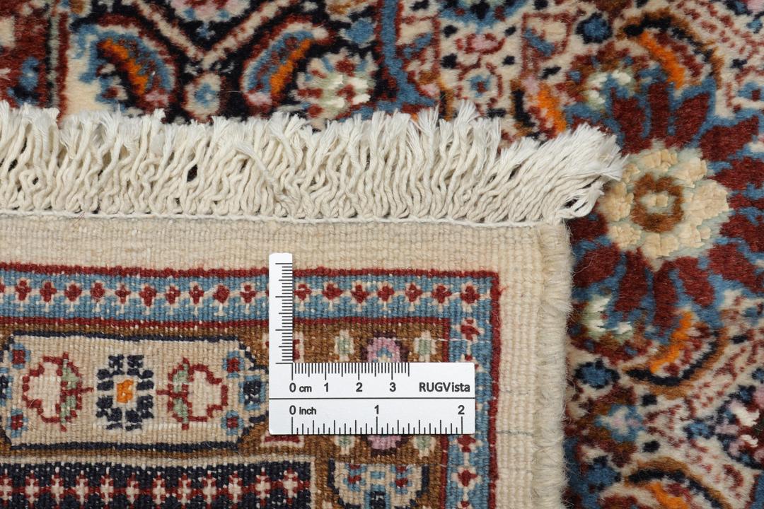 Hand-knotted Moud rug with a central medallion and ornate floral patterns in dark-red and blue