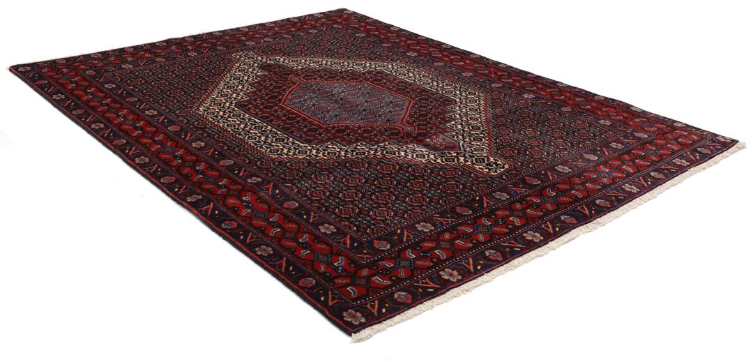 Hand-knotted Senneh rug from the Middle East in dark-red and blue tones