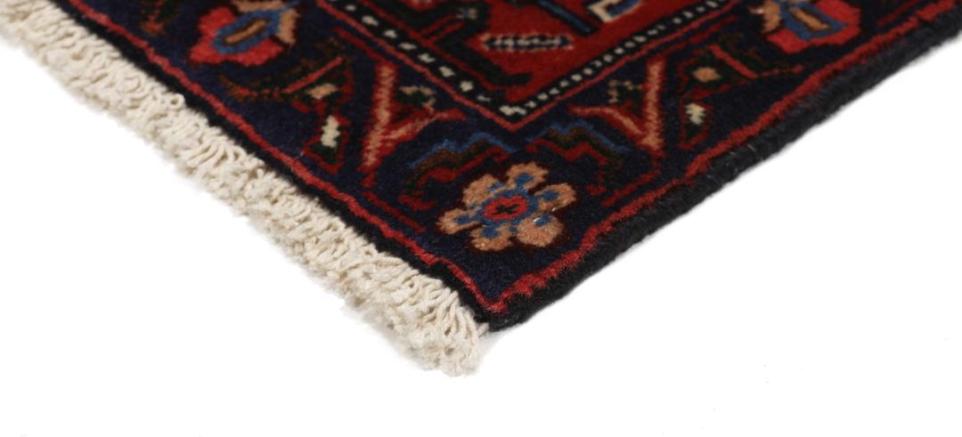 Hand-knotted Senneh rug from the Middle East in dark-red and blue tones