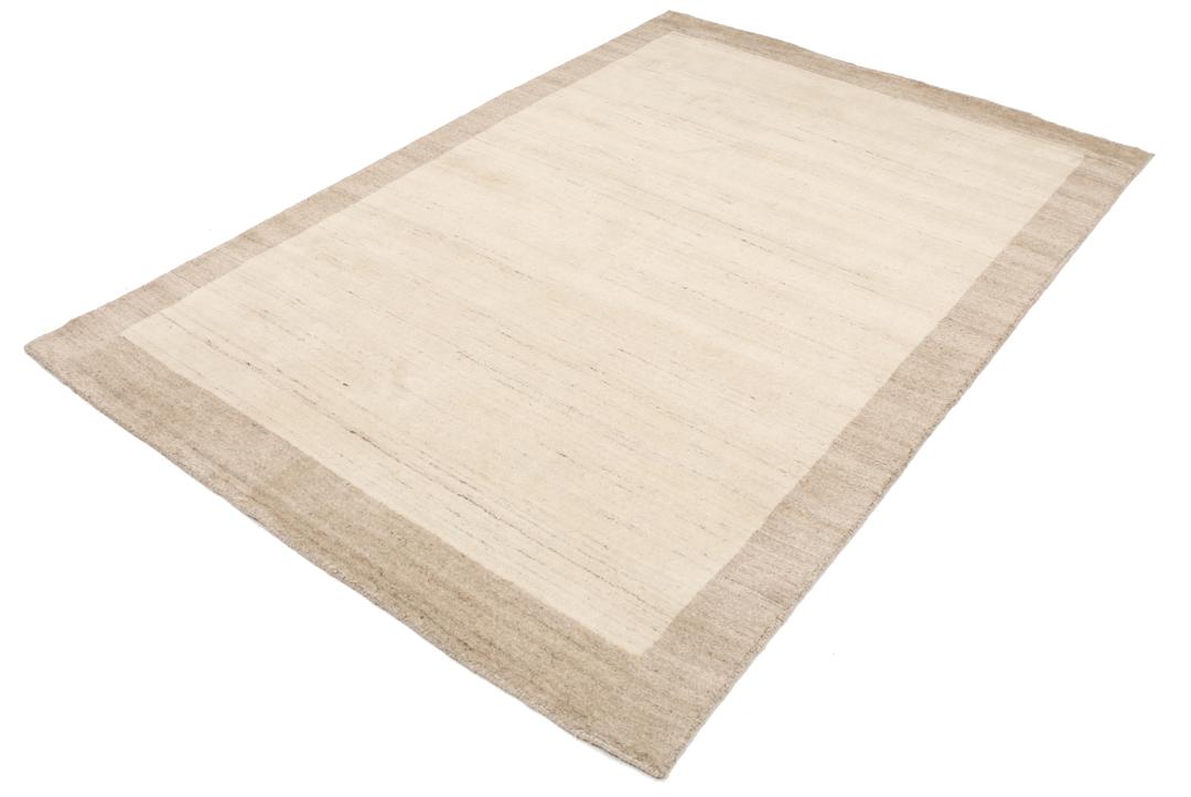 A rectangular rug in natural white and beige with a simple border design.