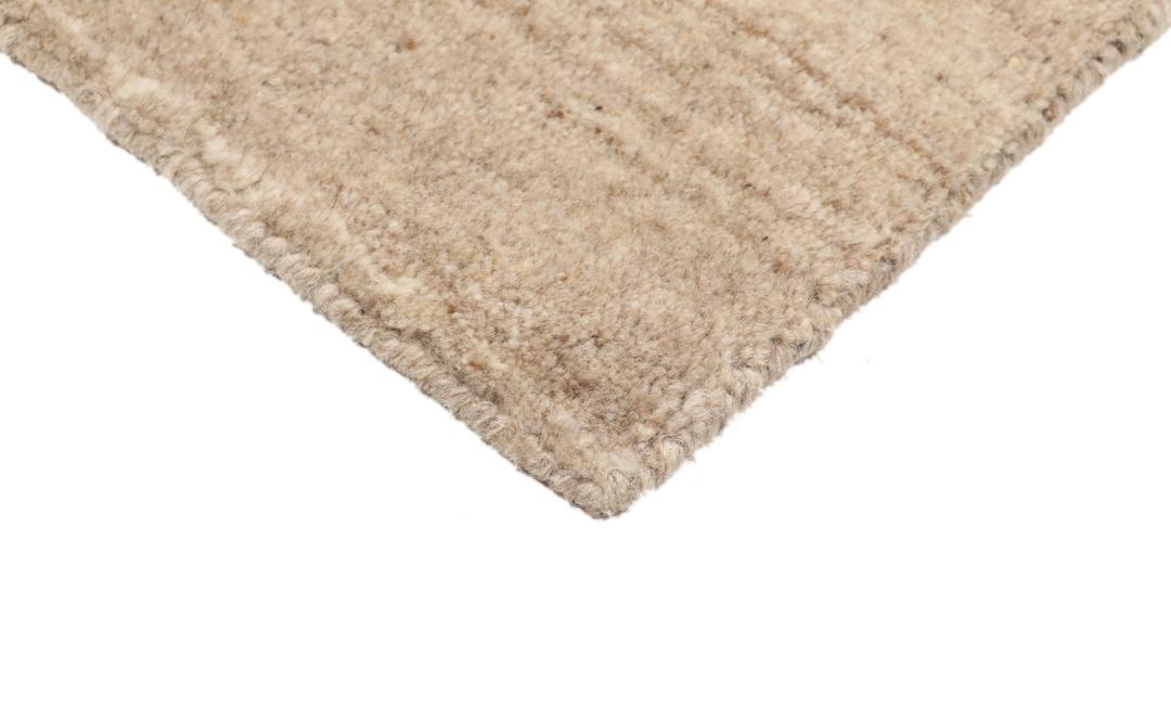 Vierkant beige tapijt met wollen pool en een eenvoudige rand