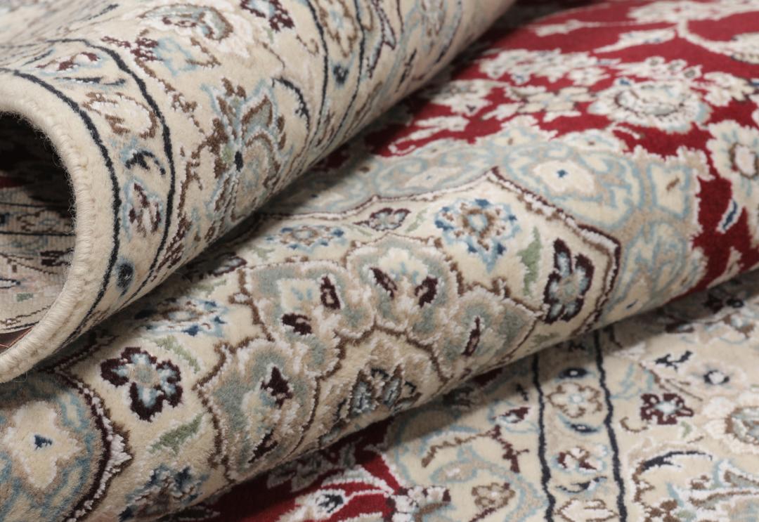 Hand-knotted Nain Fine 9La wool rug from the Middle East in red and beige tones