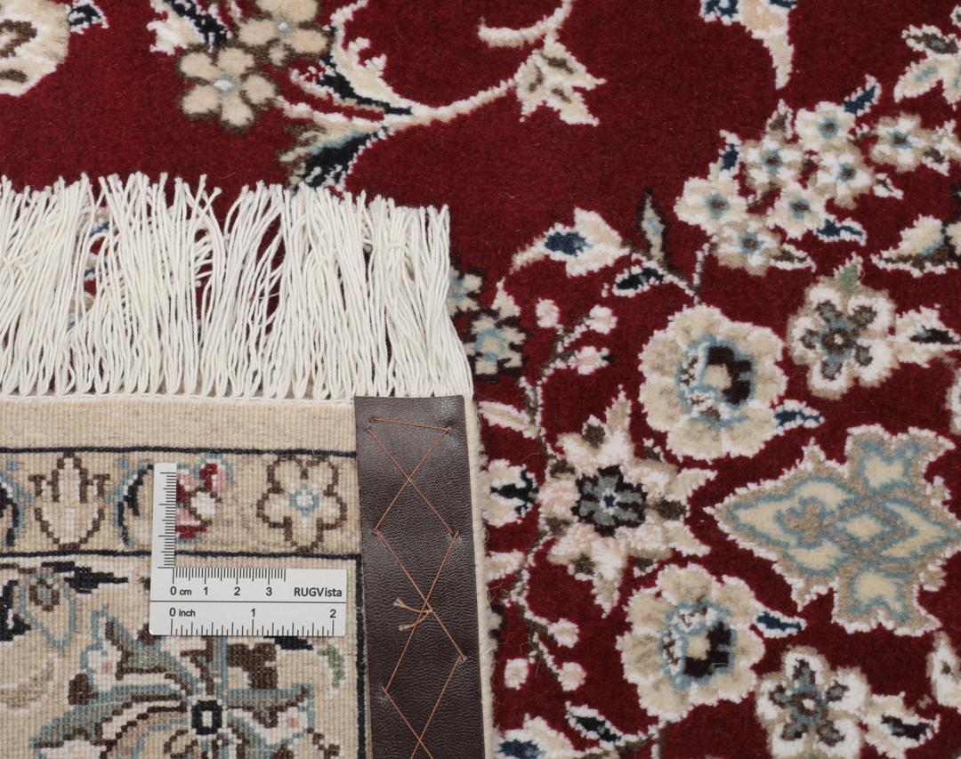 Hand-knotted Nain Fine 9La wool rug from the Middle East in red and beige tones