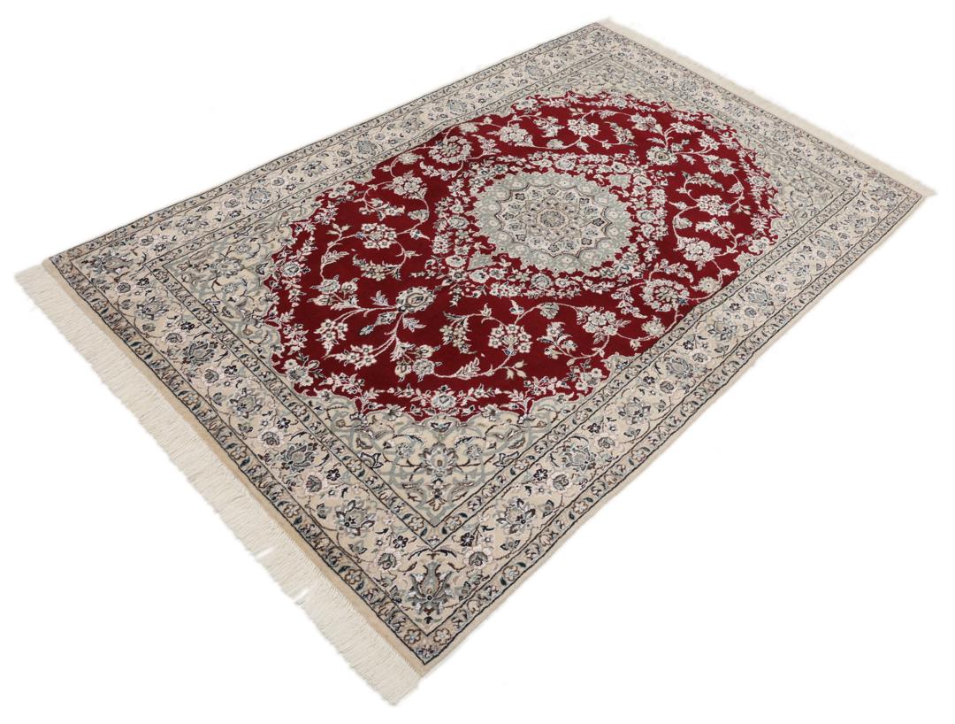 Hand-knotted Nain Fine 9La wool rug from the Middle East in red and beige tones