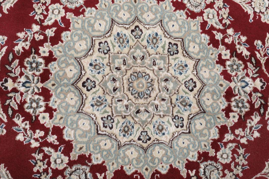 Hand-knotted Nain Fine 9La wool rug from the Middle East in red and beige tones