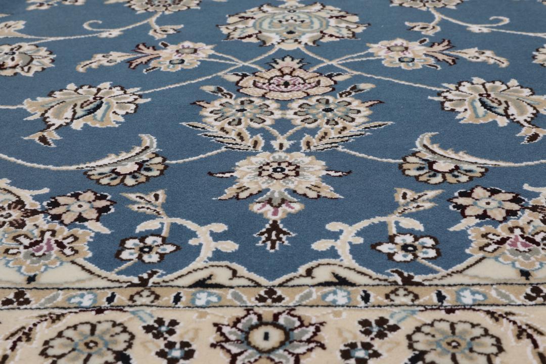 Hand-knotted Nain rug from the Middle East in blue and beige
