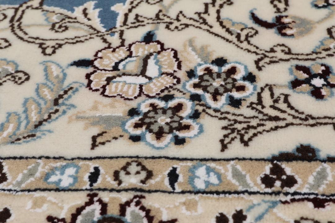 Hand-knotted Nain rug from the Middle East in blue and beige
