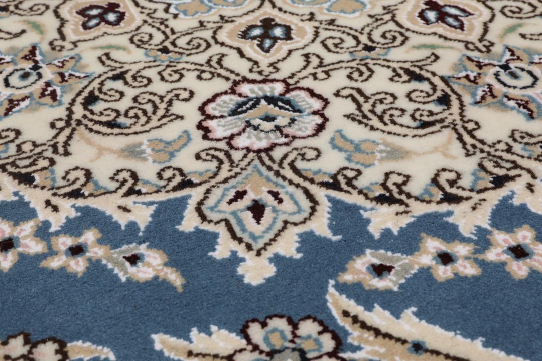 Hand-knotted Nain rug from the Middle East in blue and beige