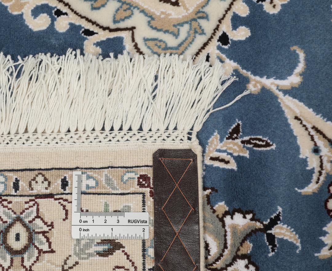 Hand-knotted Nain rug from the Middle East in blue and beige