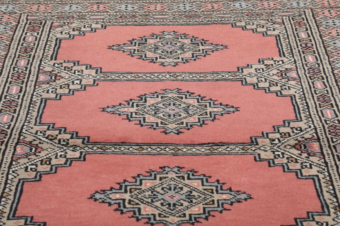 Hand-knotted Pakistan Bokhara 2ply rug in red with medallion motifs